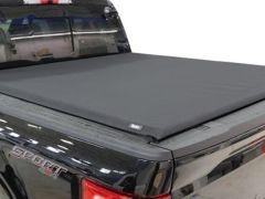 A black pickup truck with a soft black tonneau cover over its truck bed, featuring the word "SPORT" in red lettering on the tailgate.