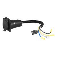 Black electrical connector with wires and terminals.