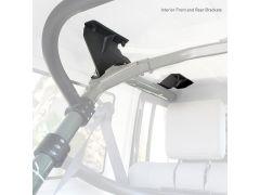 Interior view showing front and rear mounting brackets for a roll cage, with a gray crossbar and green support pole, against a light-colored vehicle interior.
