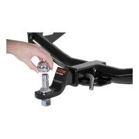 Hand holding trailer hitch ball.