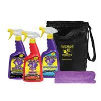 Three bottle of cleaning products labeled "Bug Release," "Mist Shine," and "Tire Vinyl Shine" next to a purple microfiber cloth and a black storage bag labeled "Wizards Products."