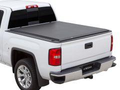 White pickup truck with black tonneau cover.