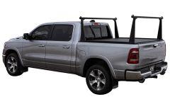 Silver pickup truck with black rack in bed.