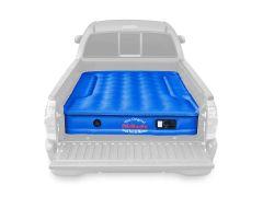 Inflatable air mattress in truck bed.