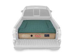 Truck bed air mattress with green top.