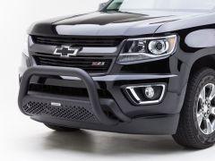 Front view of a black Chevrolet truck featuring a tubular bull bar and a shiny exterior with prominent headlights and a Chevrolet emblem.