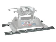Image of a heavy-duty fifth wheel trailer hitch named "The Patriot 18K by BW," featuring a metallic gray structure with adjustable sliding rails and a hand crank for secure operation.