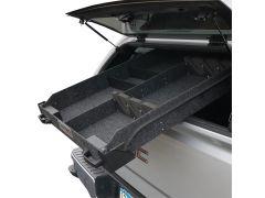Truck bed storage system with carpeted divider.
