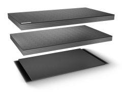 Three dark gray foam sheets with puzzle patterns stacked vertically.