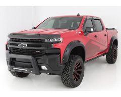Red Chevrolet pickup truck with black trim and custom wheels.