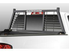 Black headache rack on a white truck bed.