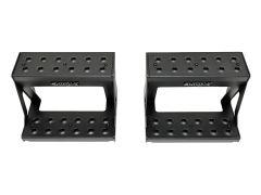 A pair of black metal footrests with a rectangular design and multiple ventilation holes, featuring the "HDX" brand logo on the front.