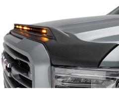 Close-up of a gray pickup truck hood with a black hood protector and illuminated amber LED lights.