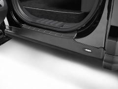 Close-up of a black car door frame with a ridged door sill protector and "Husky" branding at the bottom.