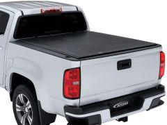 Silver pickup truck with black tonneau cover.