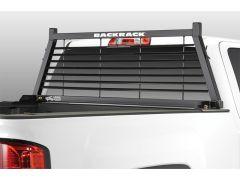 Black headache rack on white truck bed.