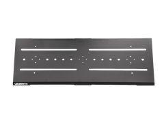 A black, rectangular metal plate with two long horizontal slots and various circular holes across its surface.