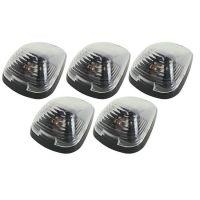 Five identical car light covers arranged in a grouping, featuring clear domes and black bases.