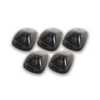 Five identical black plastic light covers arranged symmetrically. Each cover has a glossy, transparent top revealing an internal pattern.