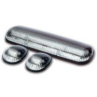 A set of three automotive light units, including a central elongated lightbar and two smaller dome-shaped lights, all with clear lenses and black housings.