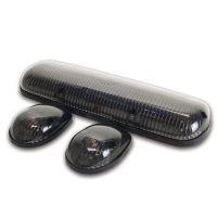 Three automotive lights: one long oval central light and two smaller oval lights, all with dark, semi-transparent casings.