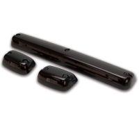 Three automotive light components in glossy black: one long rectangular piece and two smaller rounded pieces, with mounting screws visible.