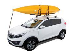 A white SUV with a yellow kayak secured on the roof with black straps.