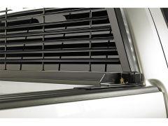 Close-up of air conditioning vent on white vehicle.