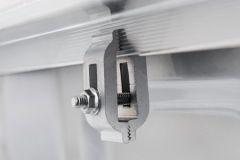 Close-up of metal bracket with screw and bolts.