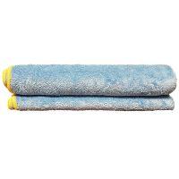Two rolled towels stacked. Both towels are a light blue with a yellow border at the edges.