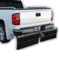 Rear view of a white pickup truck with a tow-behind broom attachment featuring two black bristle brushes.