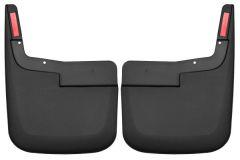 A pair of black automotive mud flaps with red reflectors, featuring a rectangular shape and mounting holes at the top.