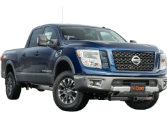 Blue Nissan Titan XD pickup truck with CURT hitch.