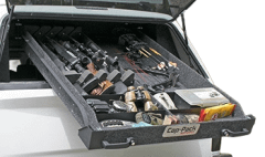 Car storage drawer with tools and equipment.
