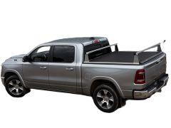 Gray pickup truck with black tonneau cover parked on a white background.