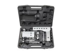 An open black plastic case containing various chrome-plated towing hitch components, including hitch balls and a measurement tool, organized in specific slots.