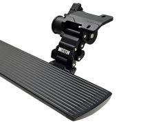 Black automotive running board with "Westin" branding on a mounting bracket.