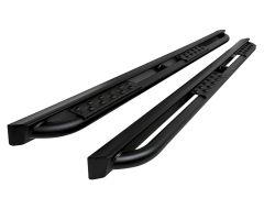 A pair of black truck side steps with textured pads on a white background.