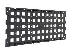 A black metal panel with a grid of square cutouts, featuring circular and elongated slots along the edges.