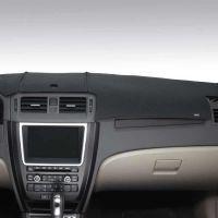 Car dashboard with smoke colored dashboard cover.