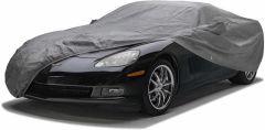 Black sports car covered with gray car cover.