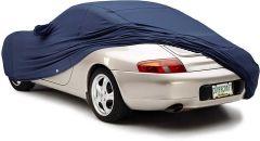 Car covered with navy blue protective cover.