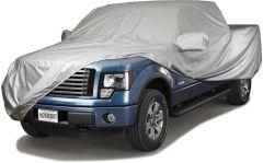 Blue pickup truck with gray protective cover.