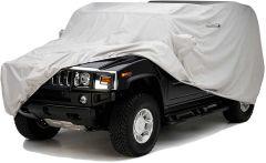 Black SUV covered with white protective car cover.