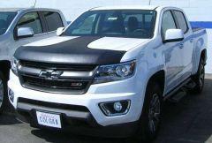 White Chevrolet Colorado ZR2 pickup truck with black hood stripes.