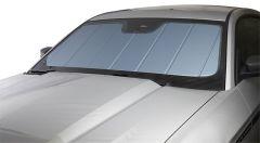 Car windshield with sunshade cover on white background.
