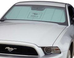 White Ford Mustang with 50 Years decal on windshield.