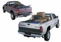 Two pickup trucks with cargo in the bed.