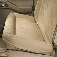 Beige car seat cover with cushion.