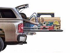 Truck bed with tools and lumber.